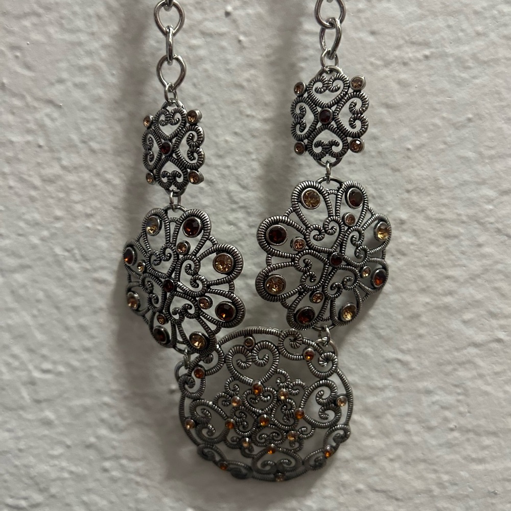 Ornate Silver and Gold Filigree Necklace with Central Lacy Design